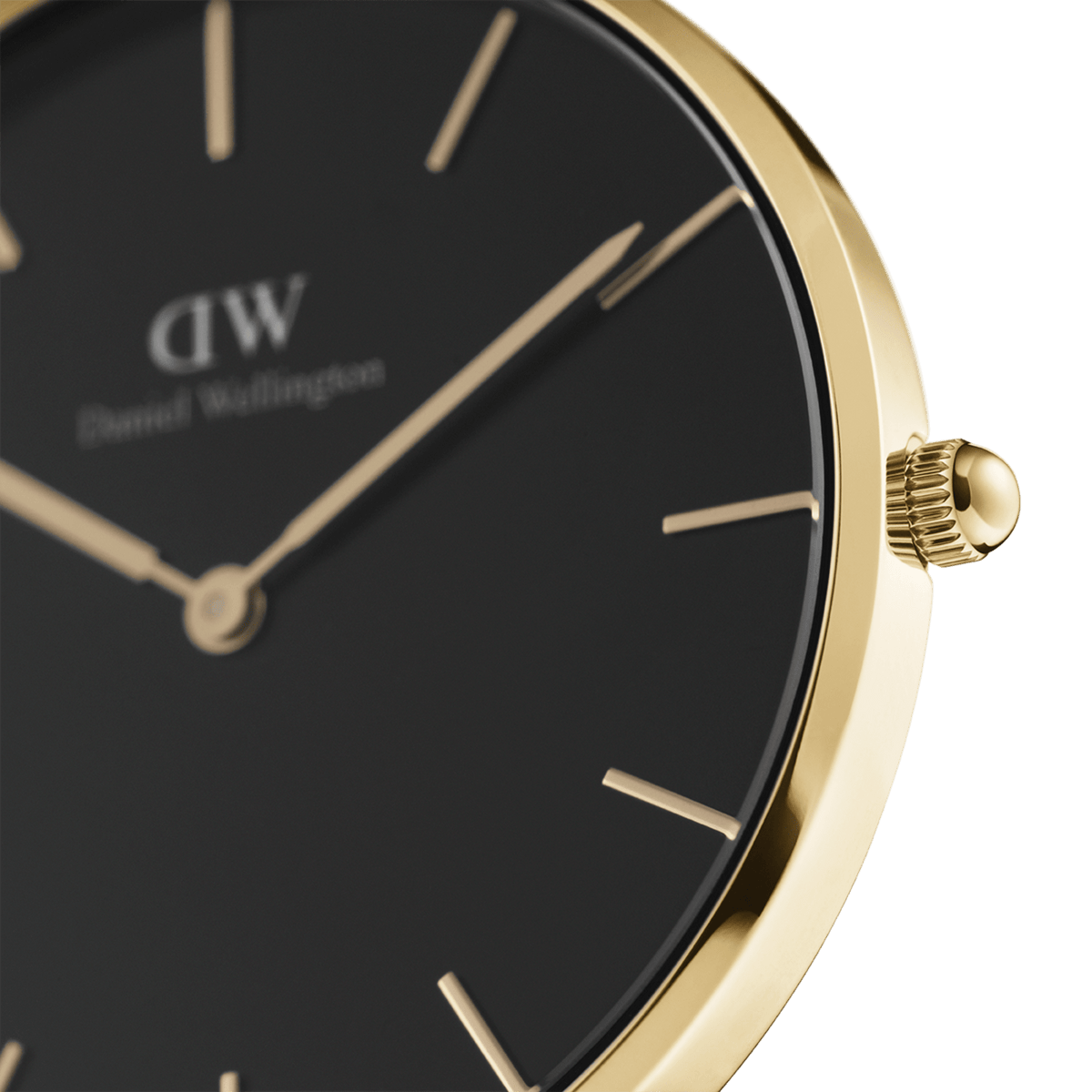 Close-up of the black dial of the Daniel Wellington Petite Evergold Black with a gold-coloured stainless steel case, slim indices, and delicate crown.