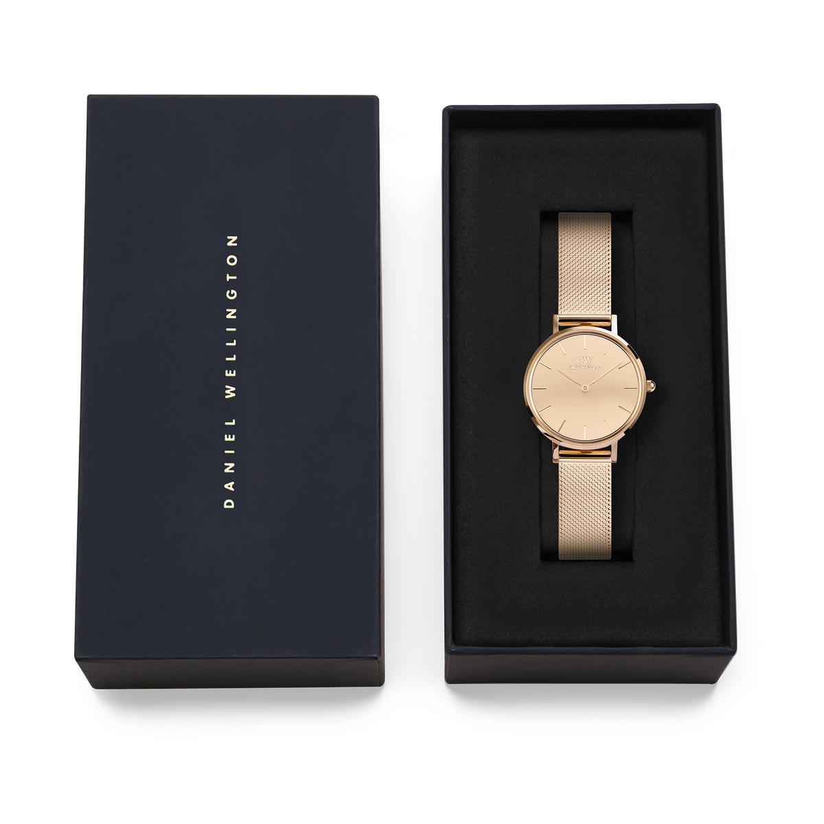 The Petite Reflection Rose Gold women's watch with a mirrored dial and mesh strap is presented in an elegant black Daniel Wellington gift box.