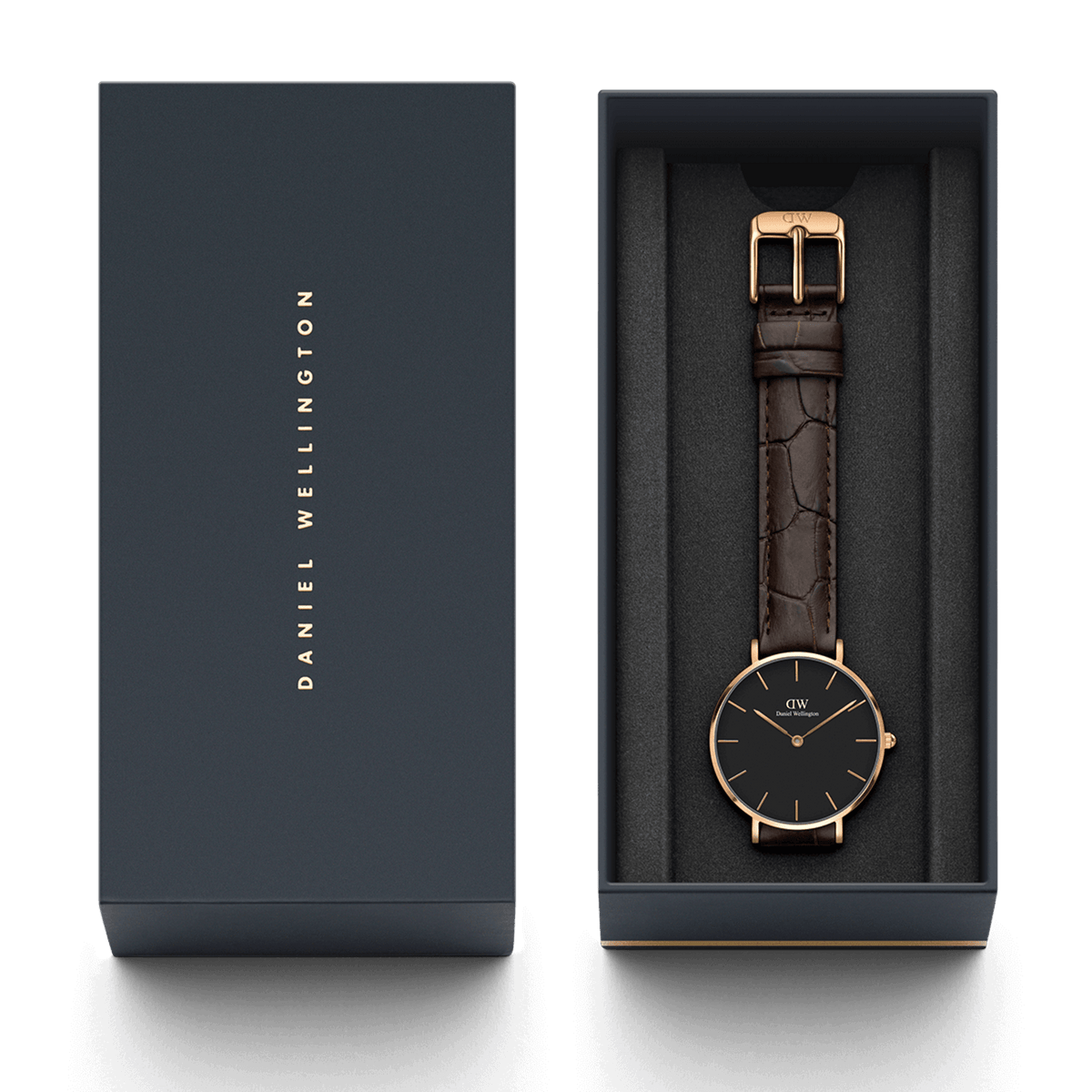Orologio Petite York Black Rose Gold, incluso nella sua confezione regalo Daniel Wellington di colore antracite. Dotato di fibbia in oro rosa e cinturino in pelle marrone con texture effetto coccodrillo.