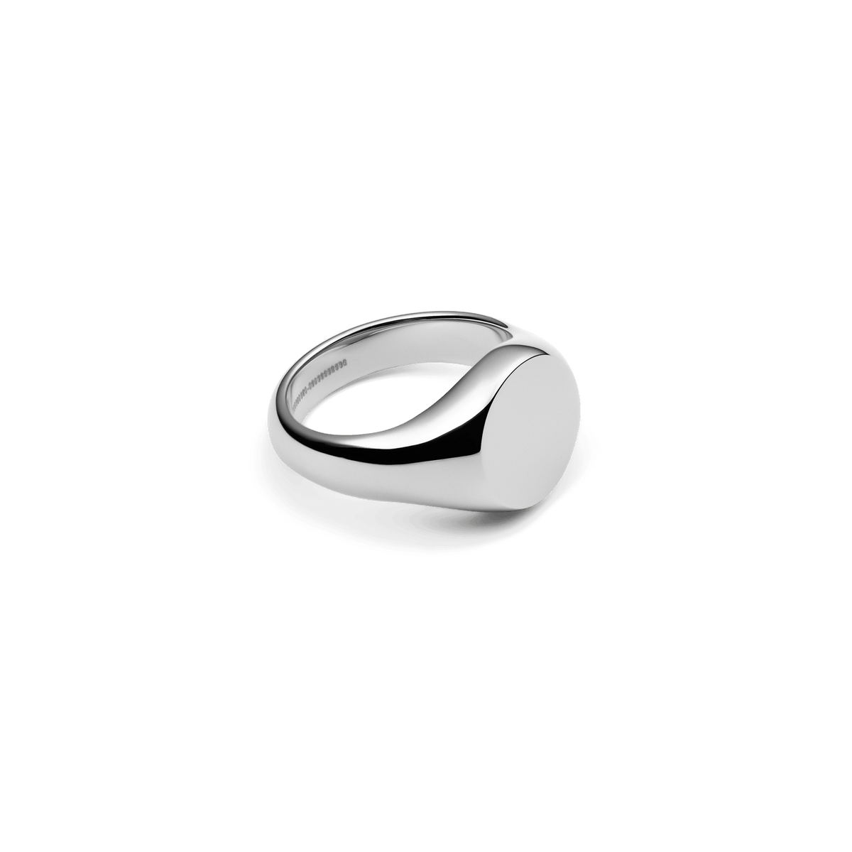Silver Classic Signet Ring made of stainless steel with a polished, round surface and minimalist design, photographed at an angle from the side.