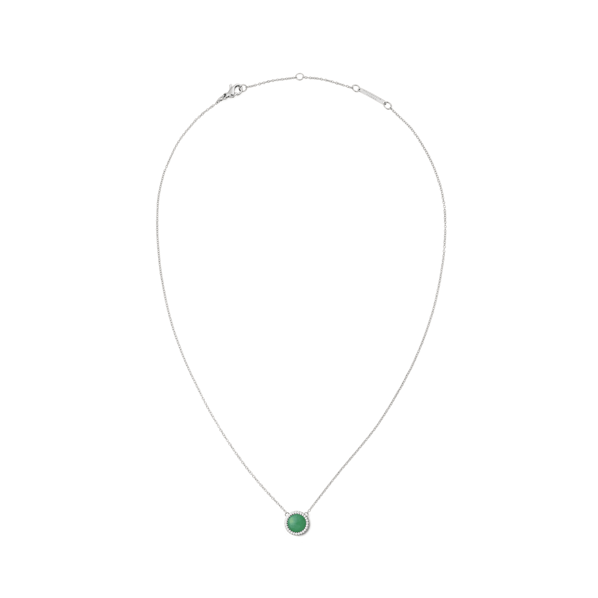 Delicate silver necklace with a round green jade pendant, framed by white zirconia crystals, designed in a minimalist and elegant style.
