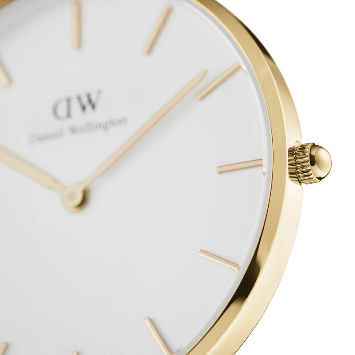 Close-up of the gold-coloured case of the Daniel Wellington Petite Evergold ladies' watch with eggshell-white dial and delicate gold indices.