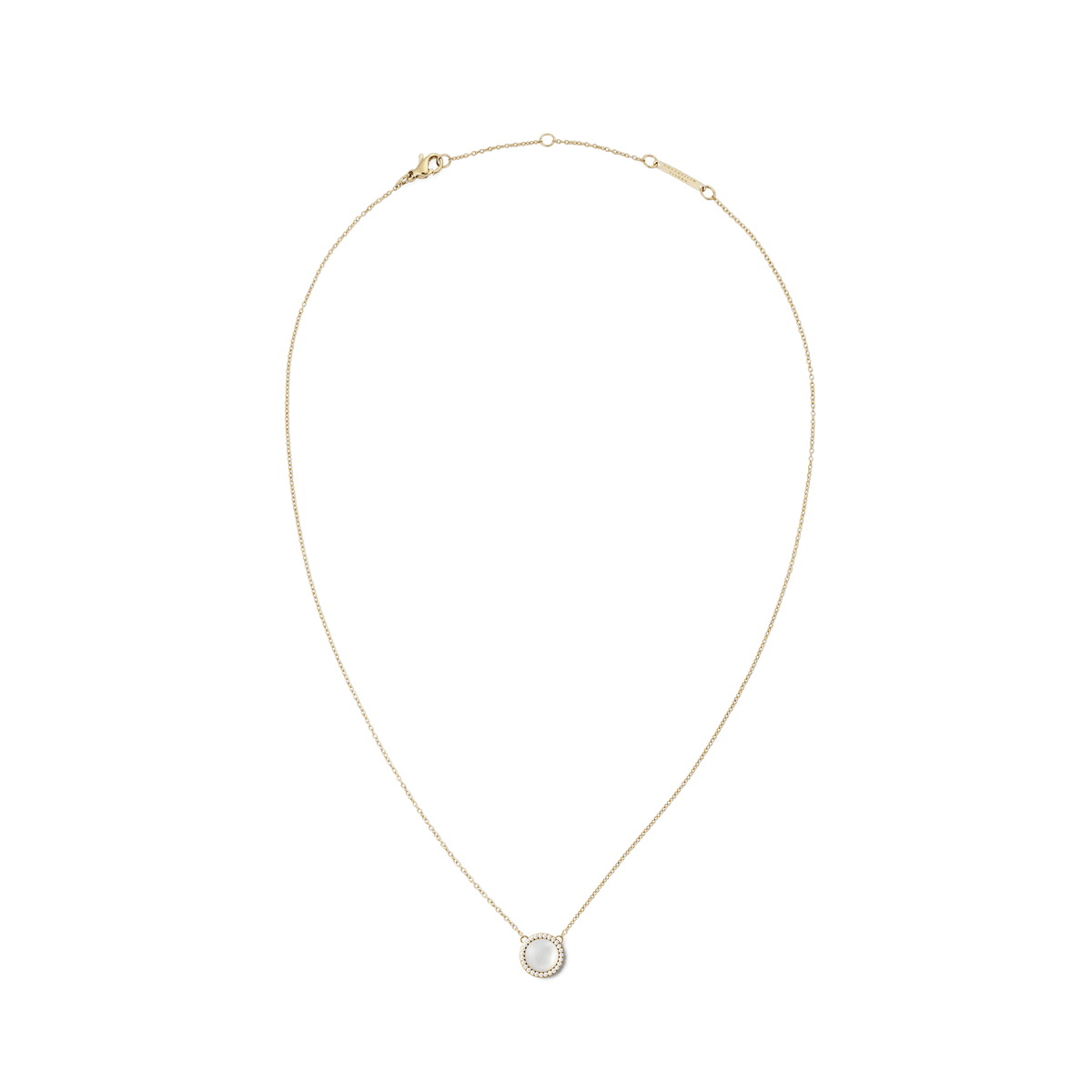 Delicate gold necklace with a round mother-of-pearl pendant, surrounded by white zirconia crystals, in a minimalist design.