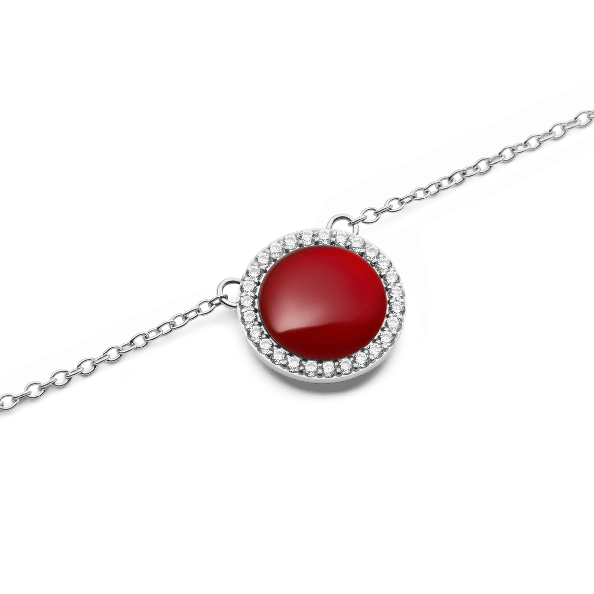 Close-up of the round red agate pendant of the Audrey necklace in silver, surrounded by sparkling white zirconia crystals on a delicate chain.