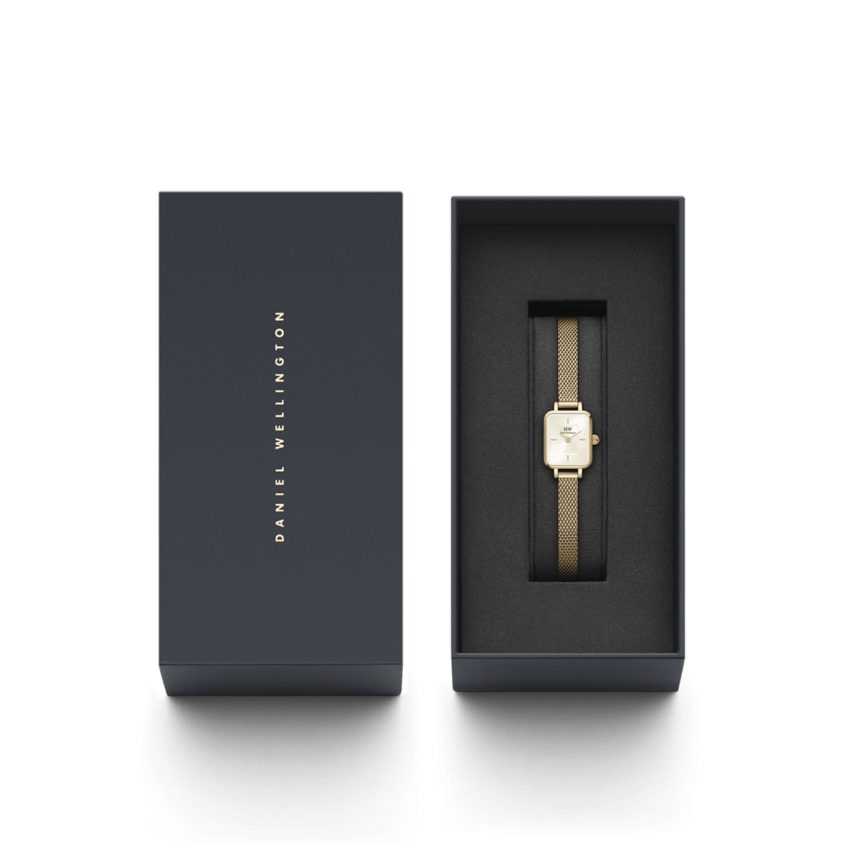 The Quadro Mini Evergold Champagne ladies' watch with gold-coloured mesh strap lies elegantly in a black Daniel Wellington gift box.