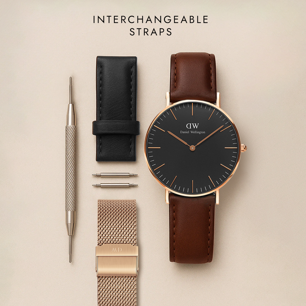 Daniel Wellington Classic Reading watch with black dial, brown leather strap, changing tool, additional black leather strap, and rose gold mesh strap.