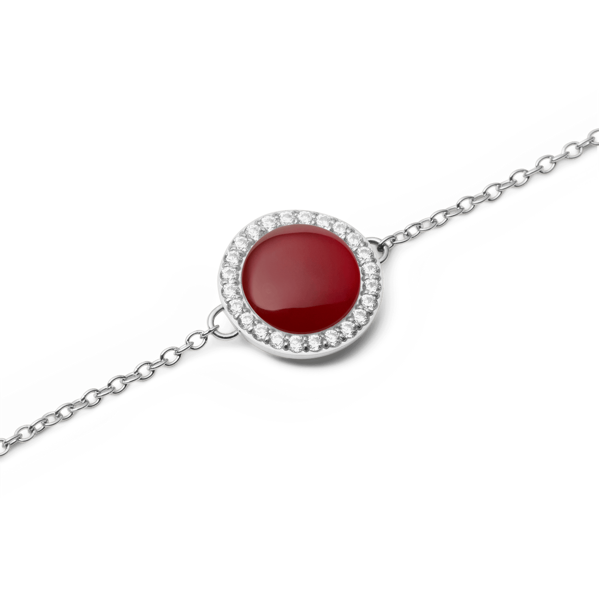 Close-up view of the Audrey Bracelet Red Agate Silver with a round red agate and surrounding white zirconia crystals on a delicate silver chain.