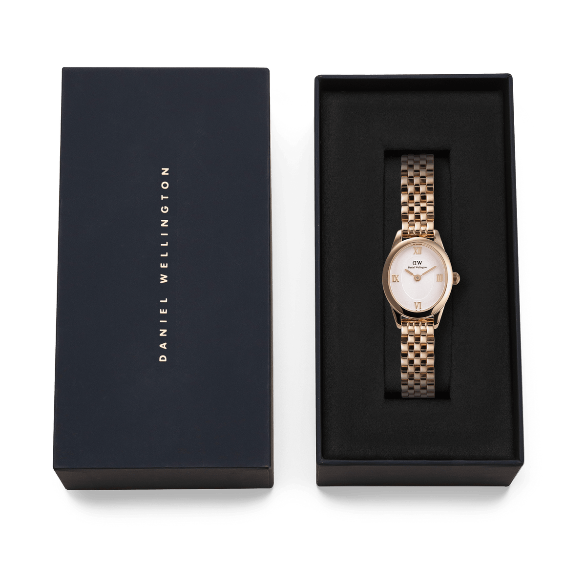 Ophelia Mini ladies' watch in rose gold with an oval case and white dial, stylishly presented in a black Daniel Wellington gift box.