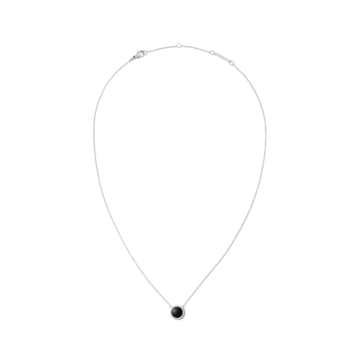 Silver necklace with a delicate chain and a round pendant made of black agate, framed by white zirconia crystals.