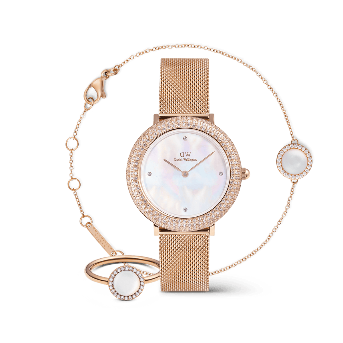 Rose gold ladies' watch set with mesh strap, sparkling crystal bezel, shimmering mother-of-pearl dial, matching bracelet and ring with mother-of-pearl inlay.