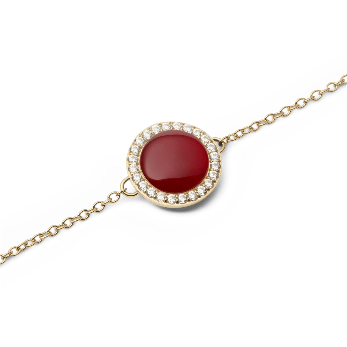 Close-up view of the Audrey Bracelet Red Agate Gold with a round red agate and sparkling zirconia crystal frame on a delicate gold-coloured chain.
