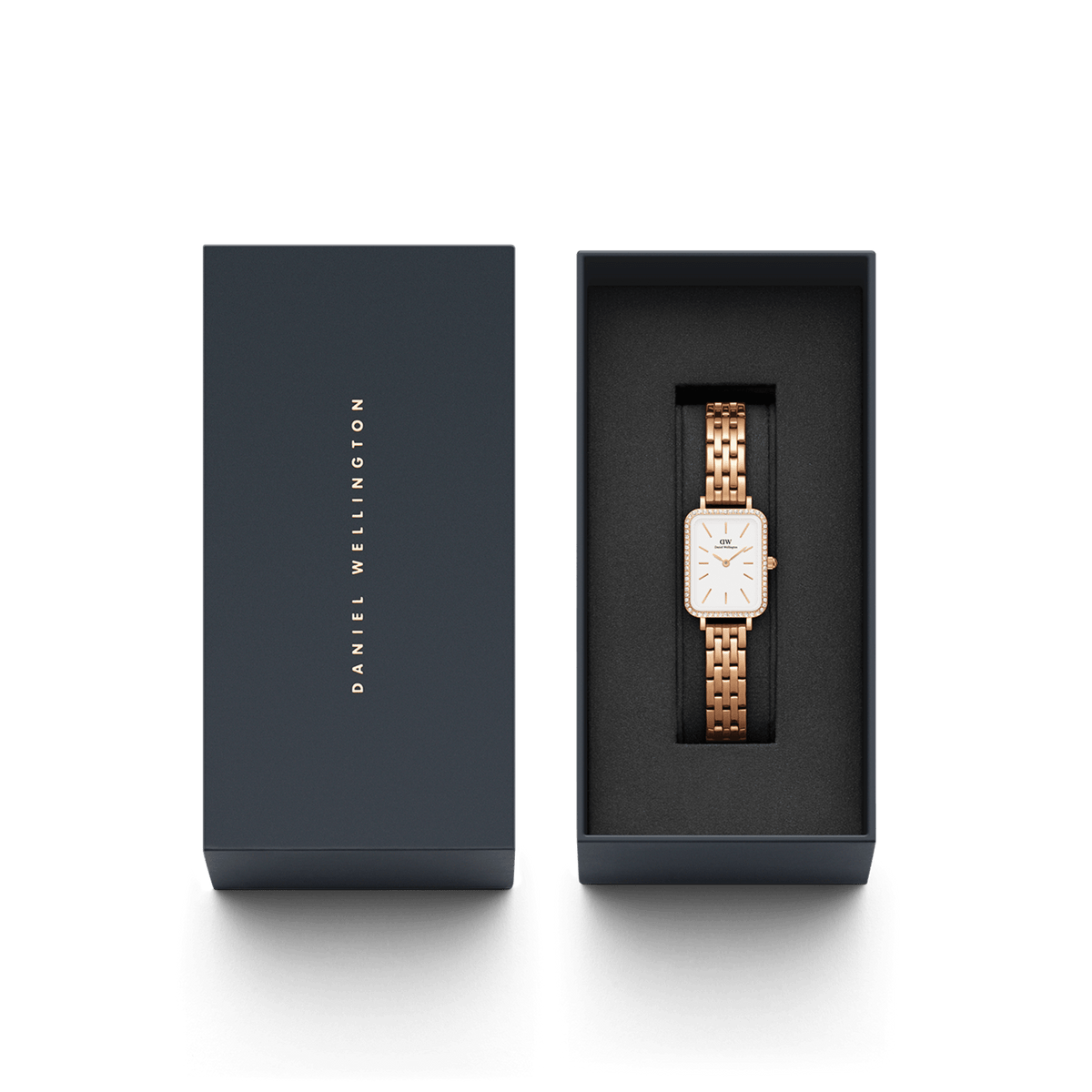 The Quadro Lumine Bezel 5-Link Melrose women's watch in rose gold with a rectangular case and sparkling bezel is elegantly presented in a premium Daniel Wellington gift box.
