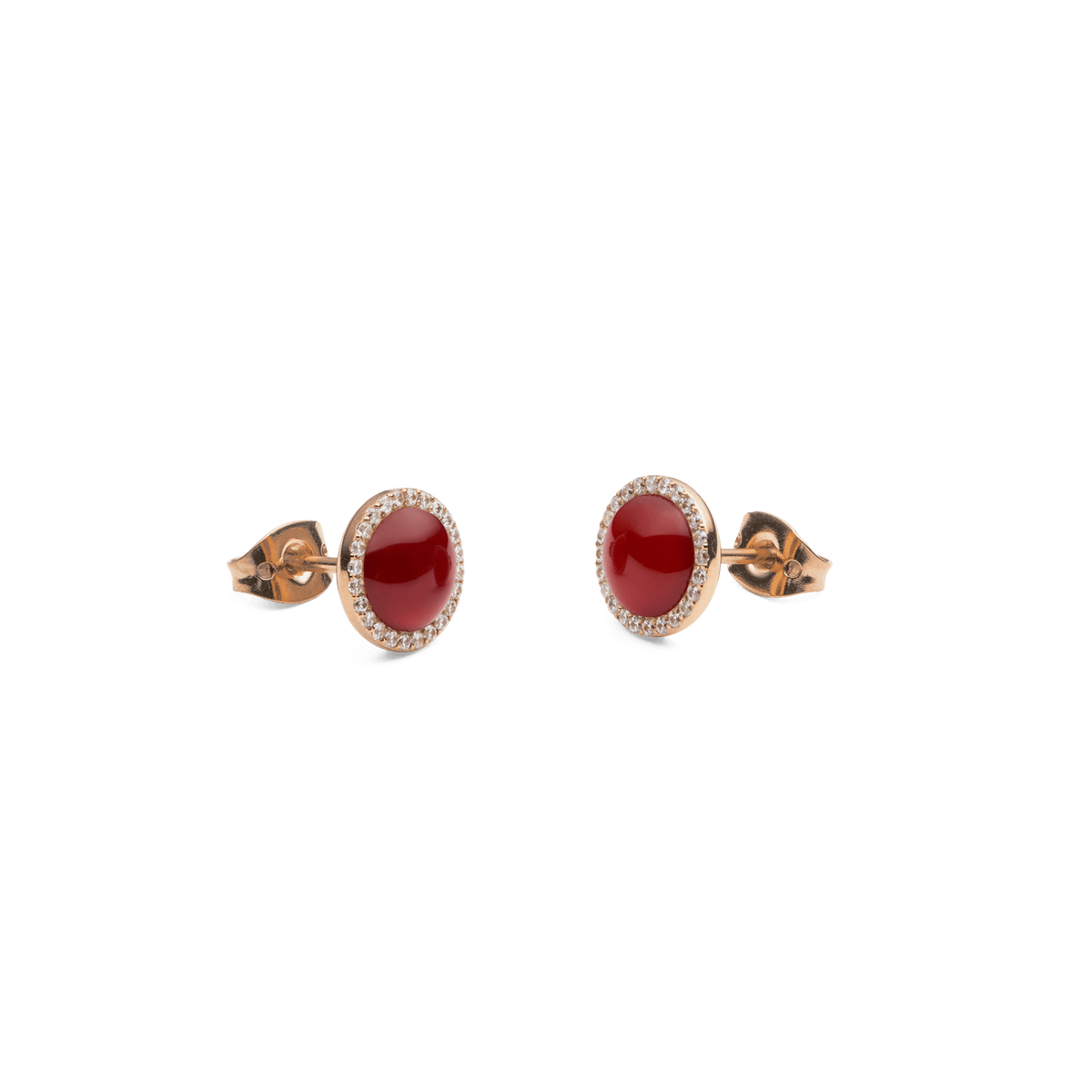 Two Audrey stud earrings in rose gold with round red agate and a delicate zirconia halo, elegantly and intricately designed.