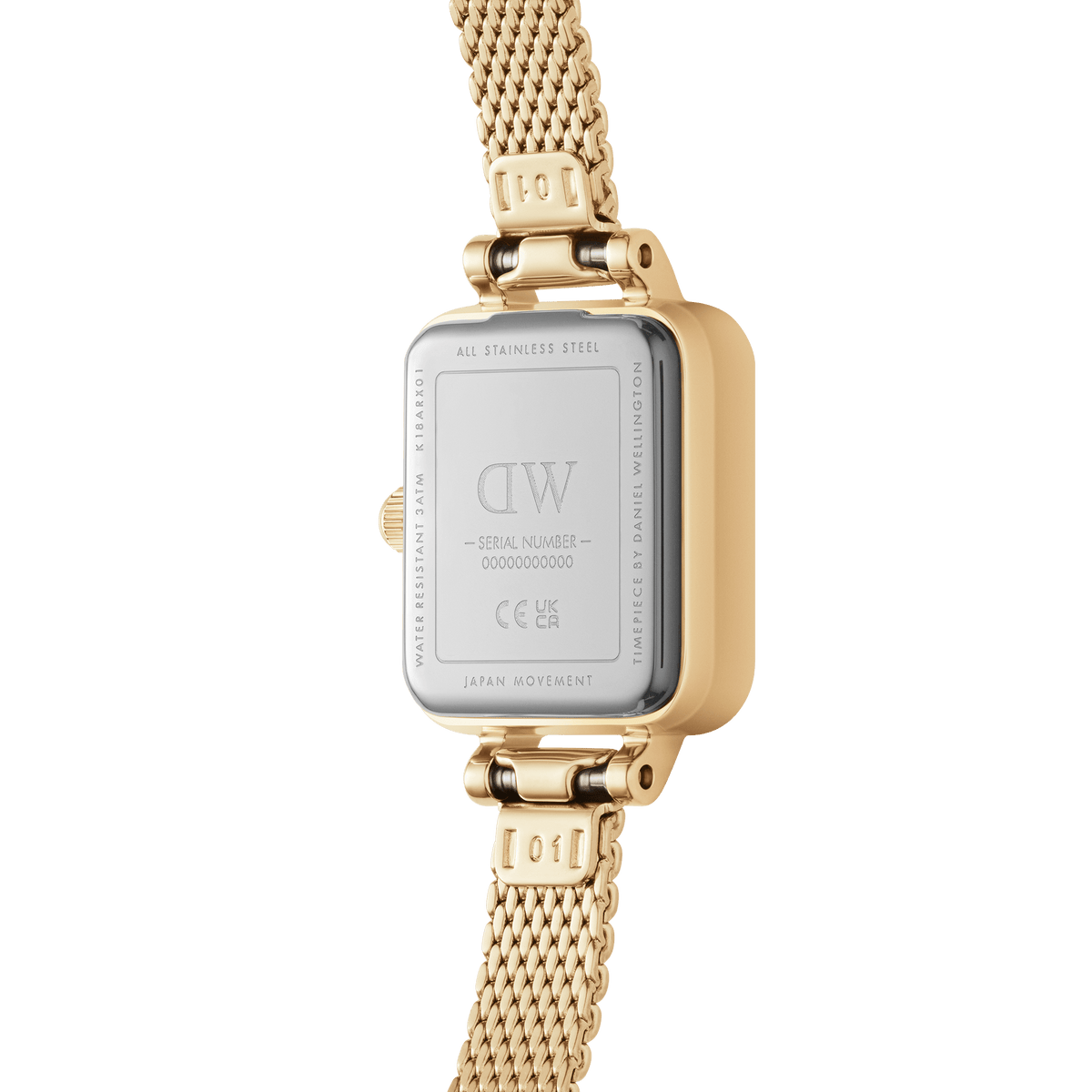 Back view of the Quadro Mini Lumine Bezel Gold with an engraved stainless steel case back, gold-coloured case, and fine mesh strap.