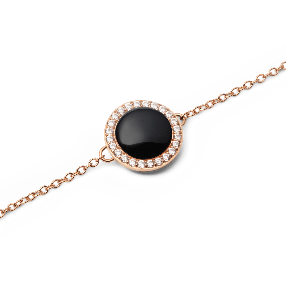 Close-up of the Audrey bracelet in rose gold with a round black agate pendant, surrounded by sparkling white zirconia crystals on a delicate chain.