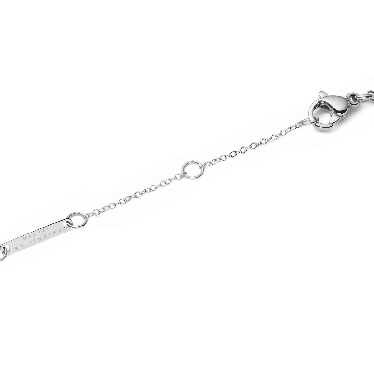 Close-up view of the adjustable lobster clasp of the Audrey Necklace Black Agate Silver, with a fine silver chain and a subtle branded tag.