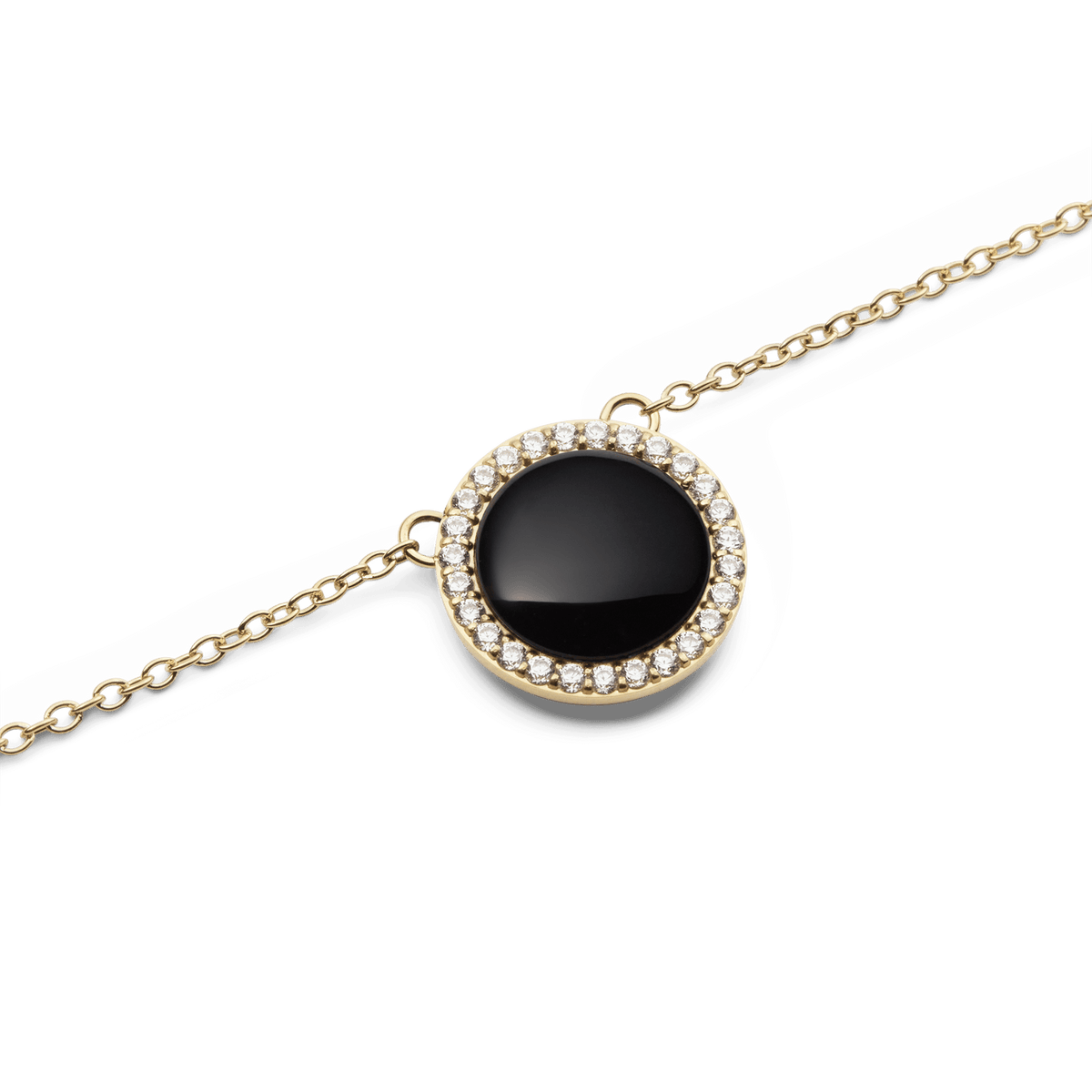 Close-up view of the gold pendant of the Audrey Necklace Black Agate Gold with a round black agate and surrounding white cubic zirconia crystals.