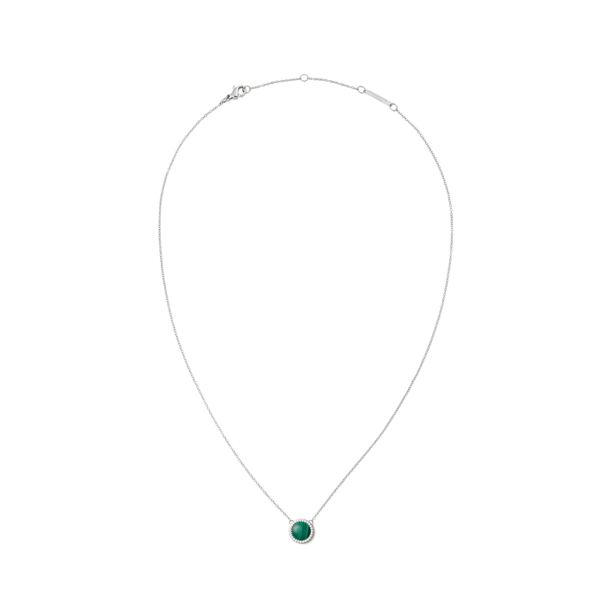 Delicate silver necklace with a round green malachite pendant, framed by small white zirconia stones, in a minimalist and elegant design.