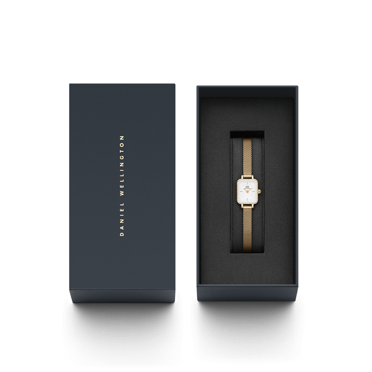 The Quadro Mini Lumine Bezel Gold with a gold-coloured mesh strap and crystal detailing is elegantly presented in a high-quality, dark blue Daniel Wellington gift box.