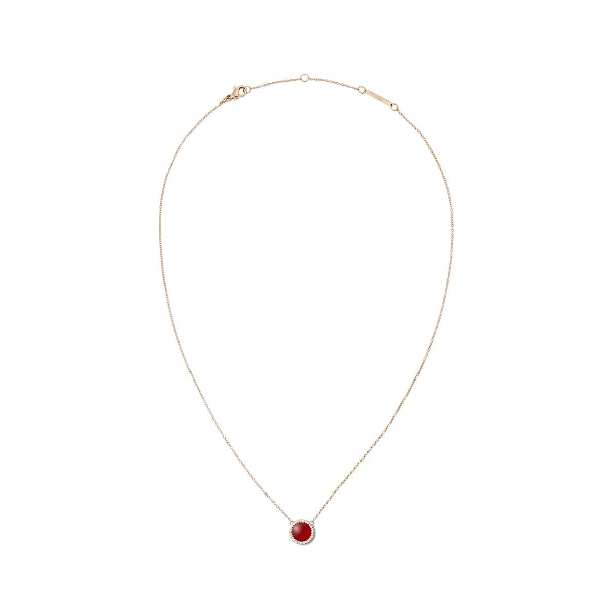Delicate rose gold necklace with a round pendant made of red agate, framed by white zirconia crystals.
