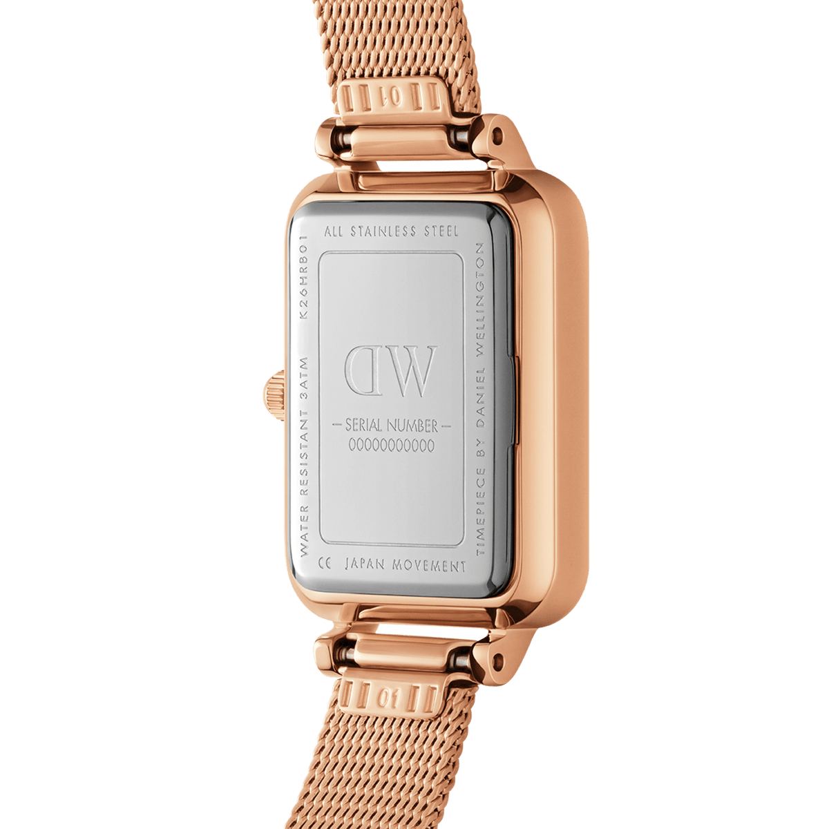 Back view of the Quadro Lumine Bezel Melrose Pink MOP ladies' watch with engraved stainless steel case back, serial number, and rose gold mesh strap.
