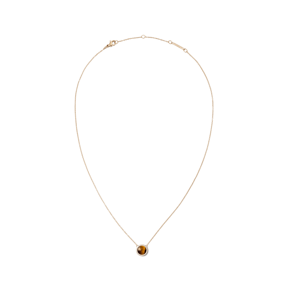 Delicate rose gold necklace with a round tiger’s eye pendant, framed by small white crystals.