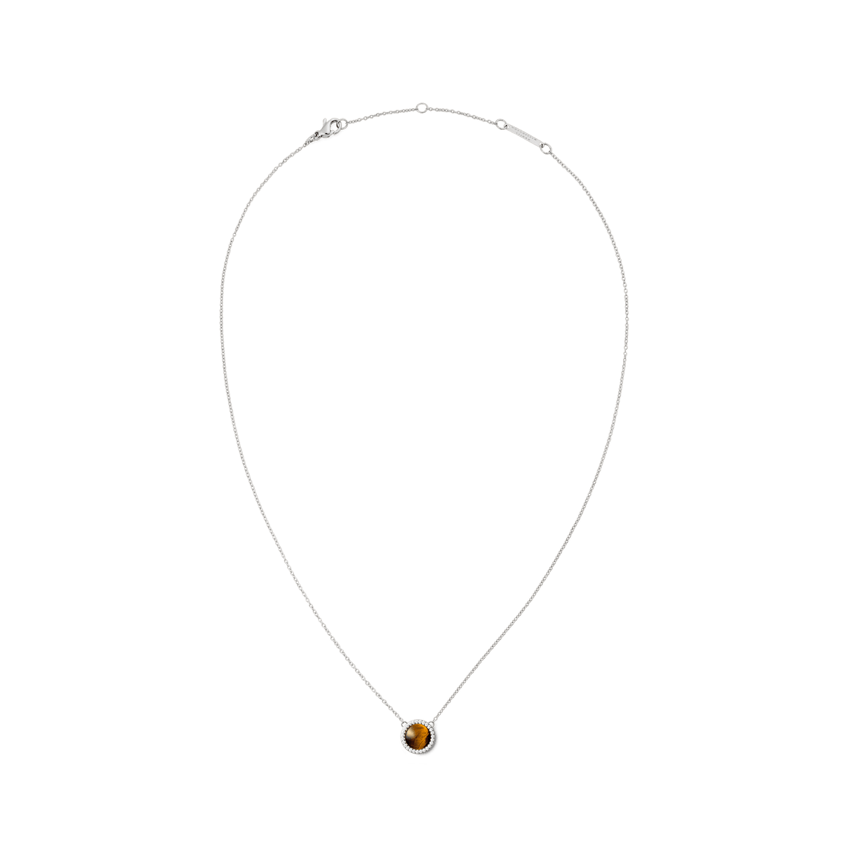 Delicate silver necklace with a round tiger’s eye pendant, surrounded by a filigree halo of white zirconia crystals.
