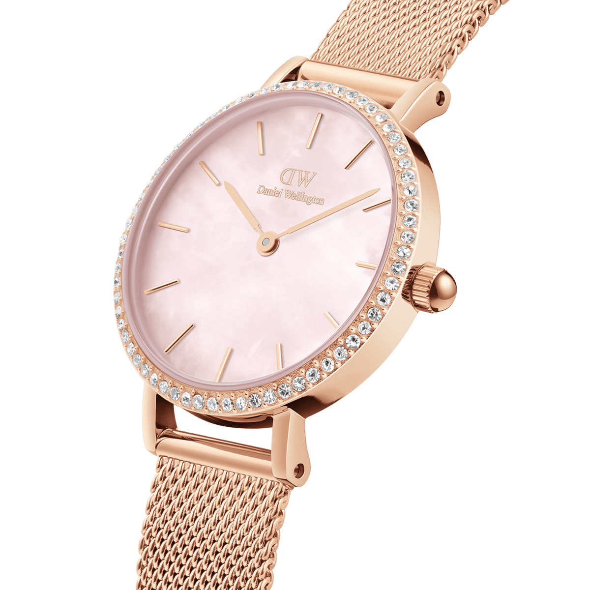 Close-up of a rose gold ladies' watch with a fine mesh strap, round case, pink mother-of-pearl dial, and a glittering bezel set with individually mounted stones.