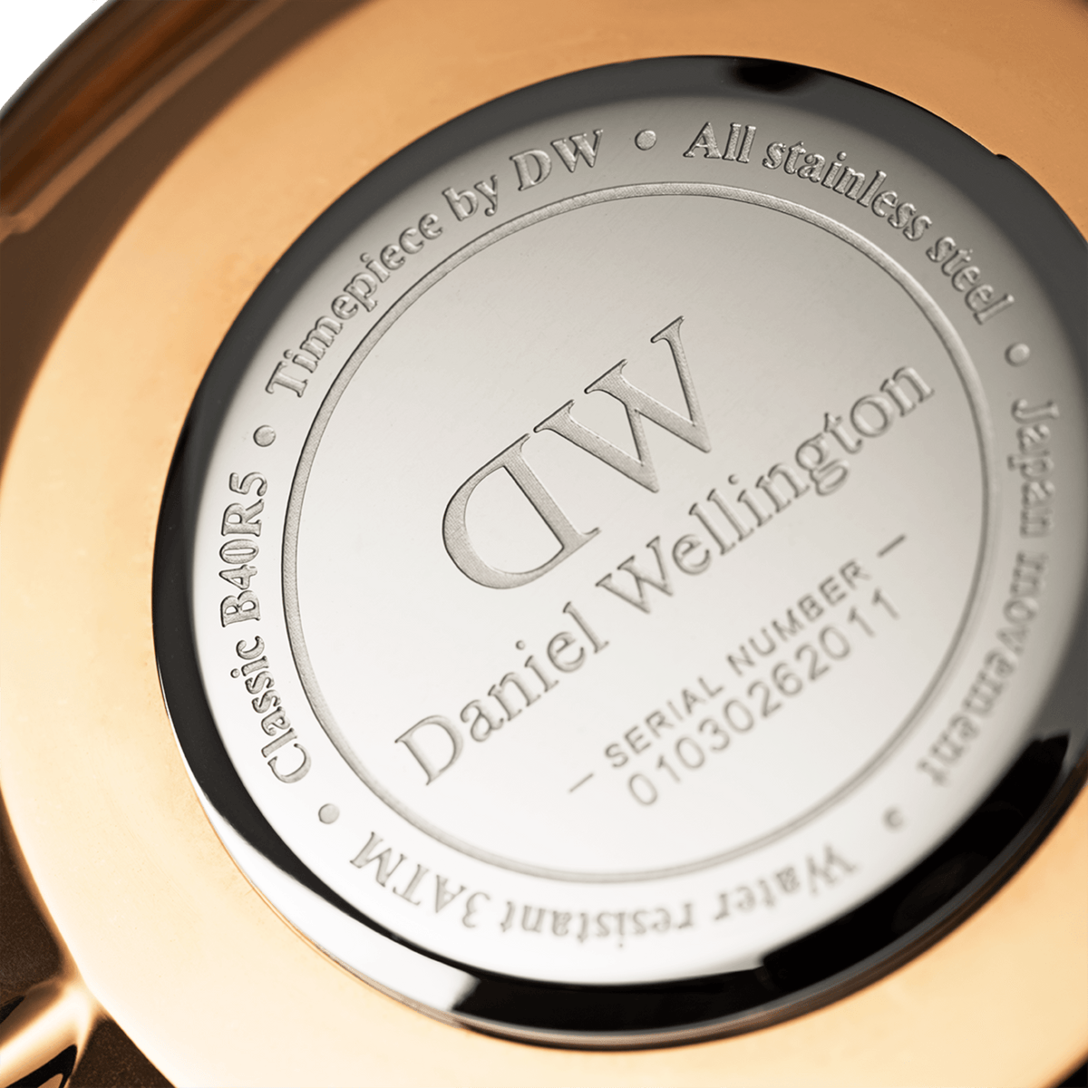 Engraved case back of the Daniel Wellington Classic Reading with model number, stainless steel, Japanese movement, and 3 ATM water resistance.
