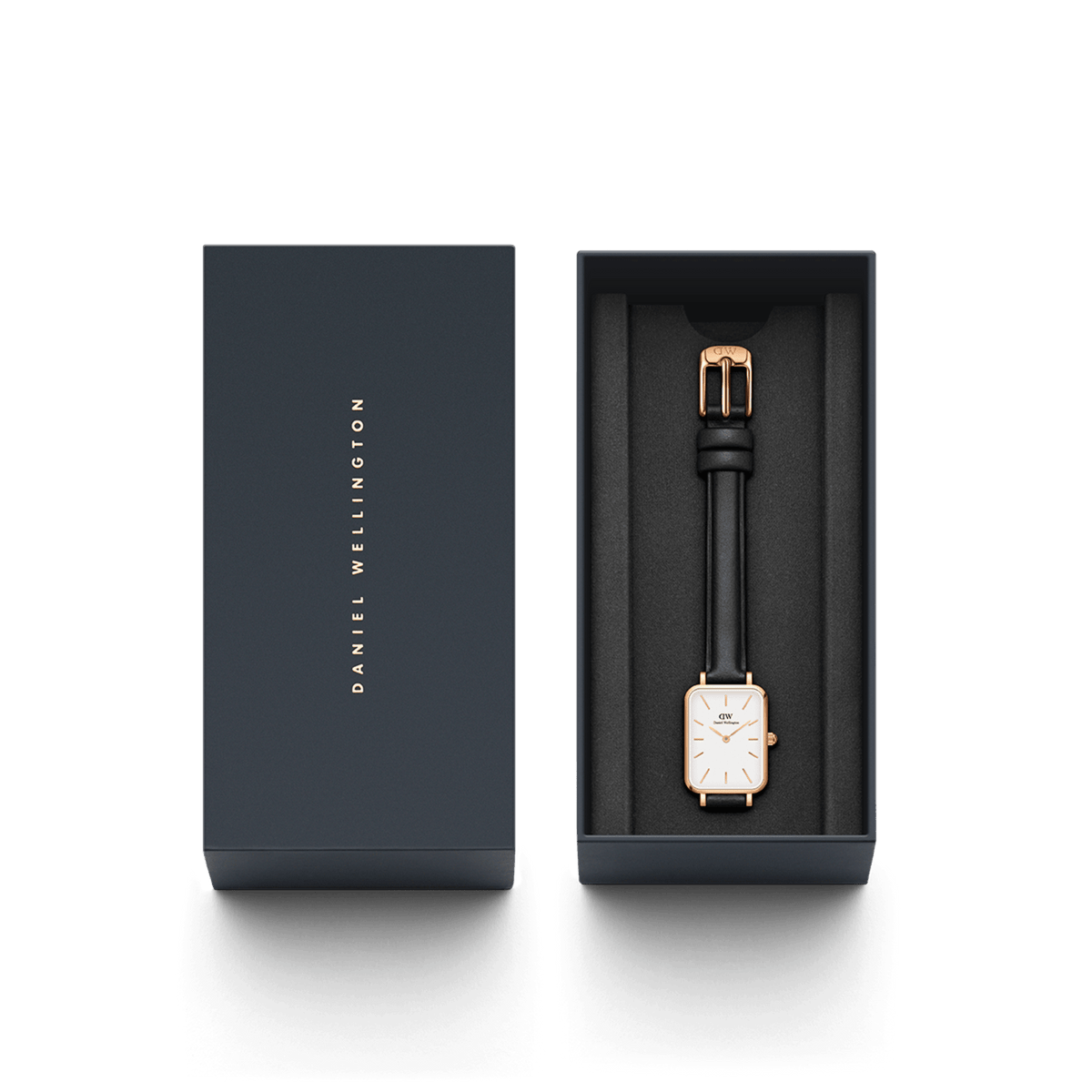 The Quadro Pressed Sheffield ladies' watch with a rectangular rose gold case and black leather strap is elegantly presented in a dark blue Daniel Wellington gift box.