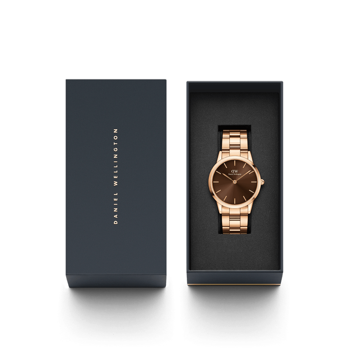 The Iconic Link Amber ladies' watch by Daniel Wellington with a rose gold link bracelet and brown dial is presented in an elegant gift box.