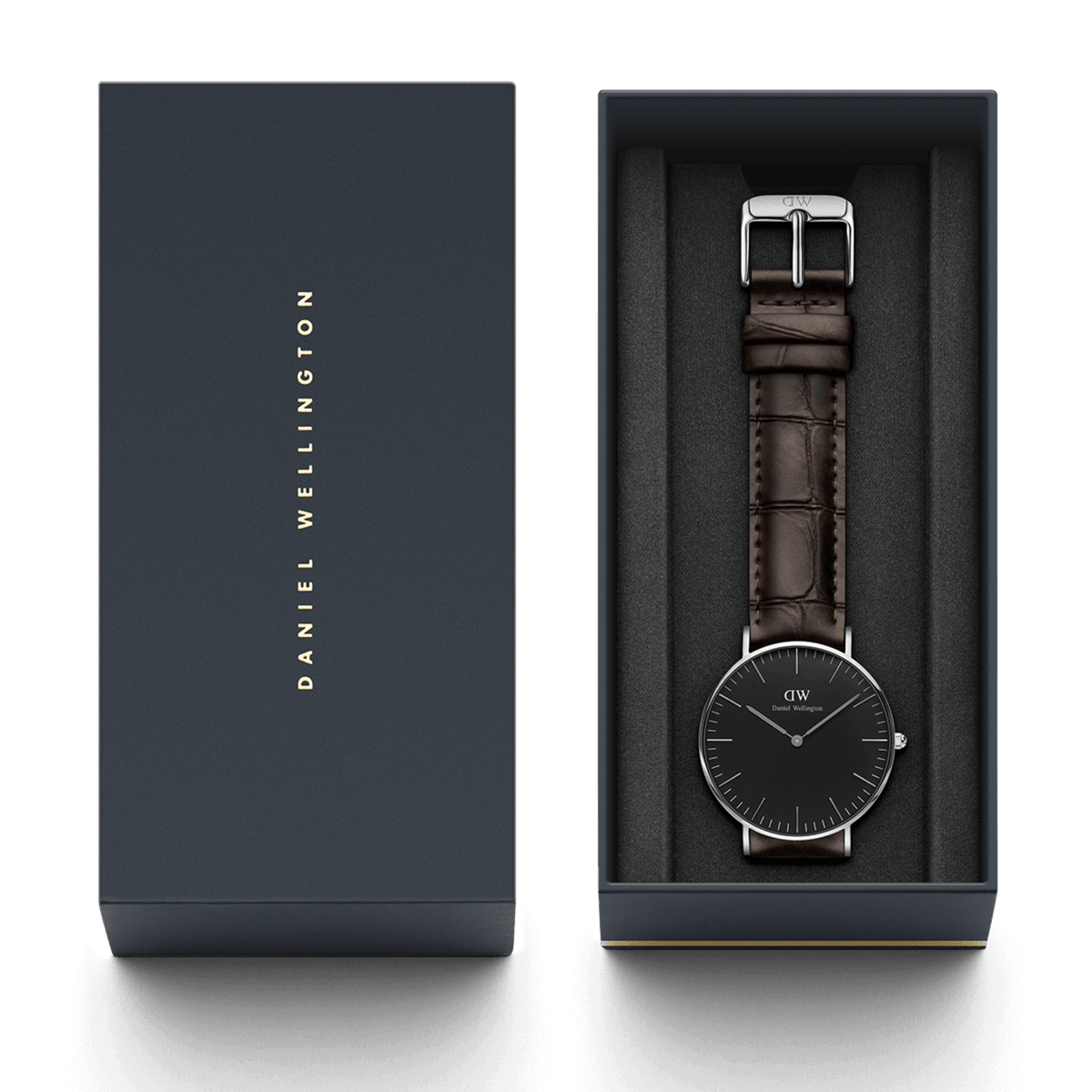 Orologio Classic York nero e argento, presentato nella confezione Daniel Wellington con interno imbottito in nero e logo stampato sul coperchio.