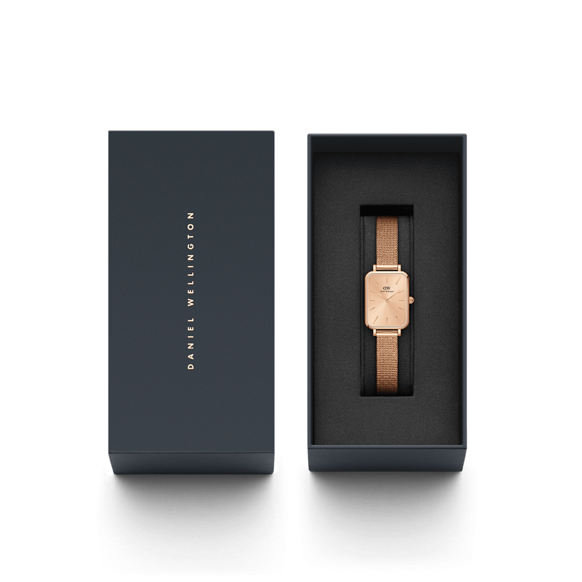 The Quadro Pressed Unitone women's watch in rose gold with a rectangular case and mesh strap is elegantly presented in a black Daniel Wellington gift box.