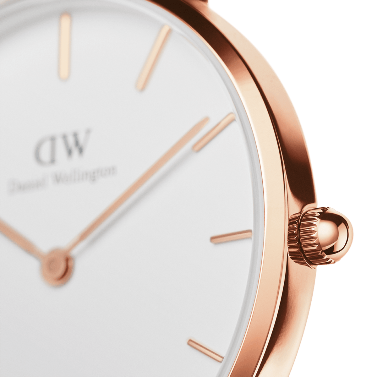 Close-up of the round case of the Petite Melrose ladies' watch in rose gold with an eggshell white dial and delicate hands.
