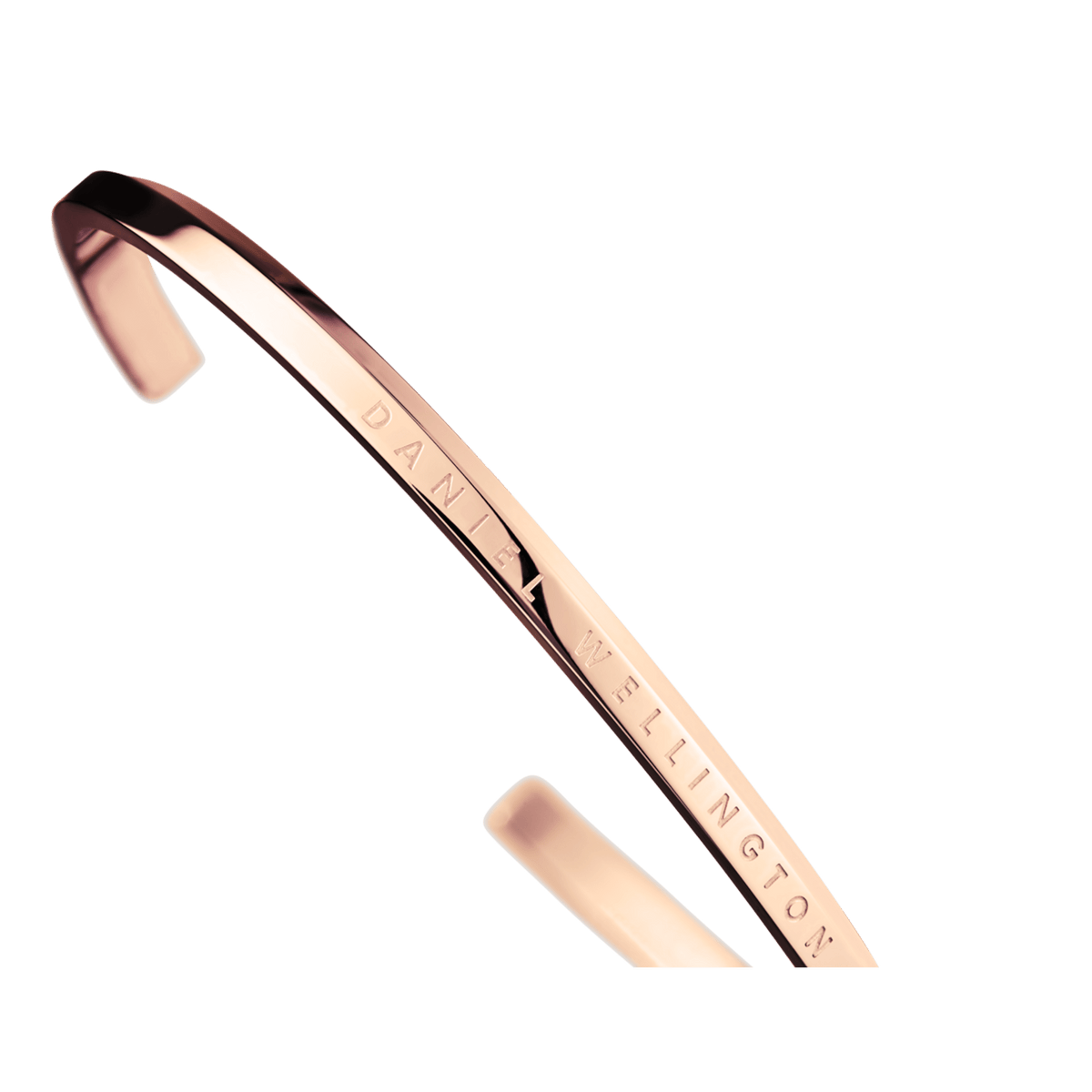 Close-up of a Classic Bracelet in rose gold by Daniel Wellington with engraved logo and shiny, polished finish.