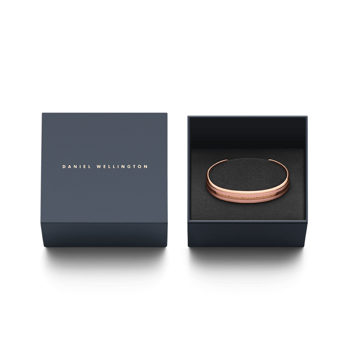 Bracciale Emalie in oro rosa, presentato nella sua confezione Daniel Wellington grigio scuro con interno nero e imbottitura in tessuto.