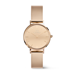 Elegant women's watch in rose gold with a round, reflective dial and a fine stainless steel mesh strap, designed in a minimalist and stylish manner.