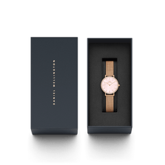 Rose gold ladies' watch Petite Lumine Bezel Melrose Pink MOP with pink mother-of-pearl dial and mesh strap stylishly presented in an elegant Daniel Wellington gift box.
