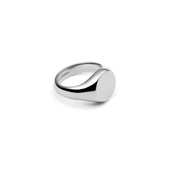 Silver Classic Signet Ring made of stainless steel with a polished, round surface and minimalist design, photographed at an angle from the side.