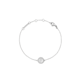 Delicate silver bracelet with a round mother-of-pearl pendant, surrounded by white cubic zirconia crystals and a lobster clasp.