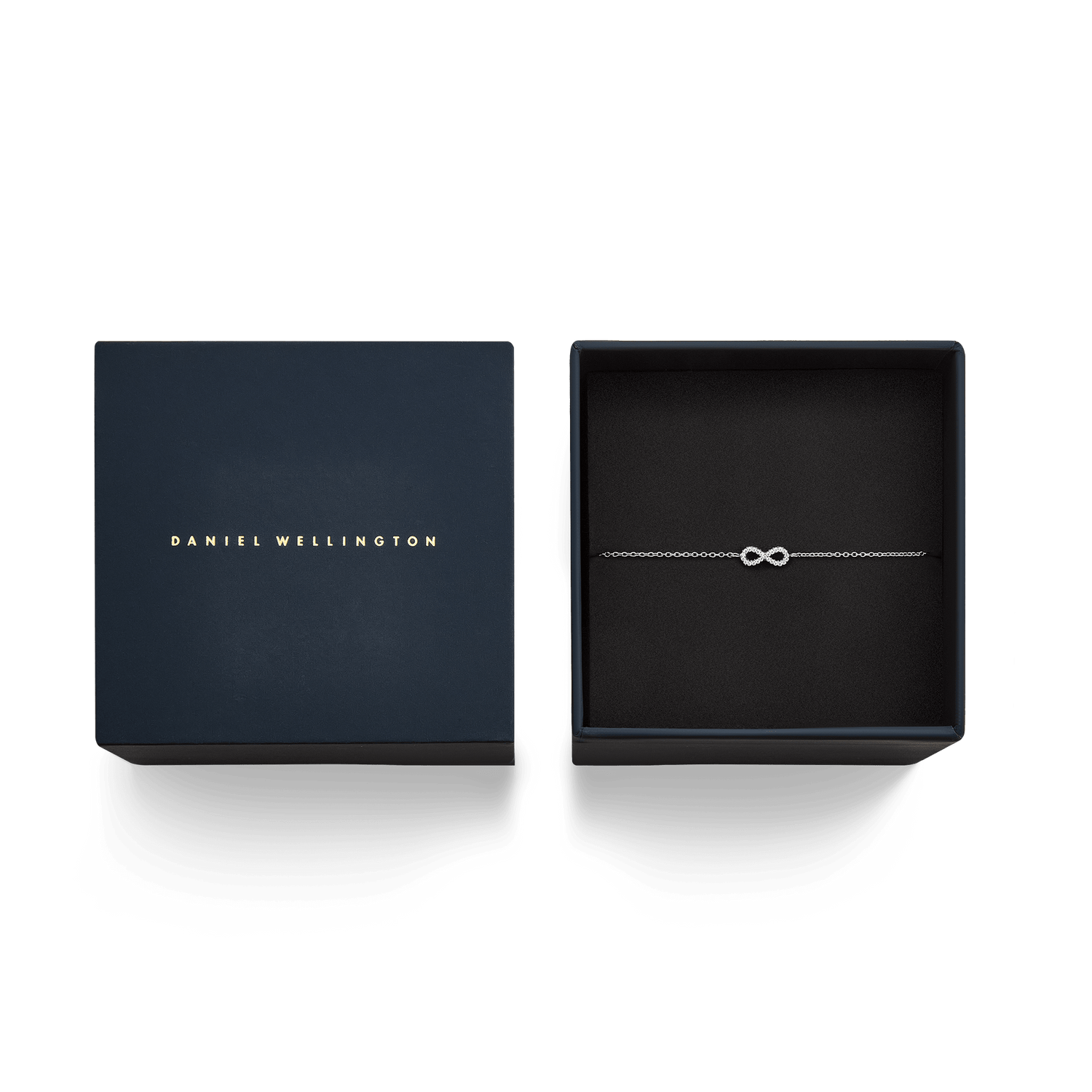 Bracciale Mirelle Infinity in argento, incluso nella confezione regalo Daniel Wellington blu scuro con interno nero. Il design raffinato del gioiello presenta il simbolo dell'infinito impreziosito da zirconi.
