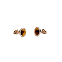 Side view of Audrey earrings in rose gold with a round tiger's eye gemstone and a delicate zirconia border, intricately and elegantly designed.