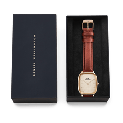 Daniel Wellington Marlon St Mawes Linen Rose Gold with brown leather strap and cushion-shaped case in an elegant gift box.