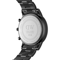 Back of the Iconic Chronograph Link Onyx B with engraved Daniel Wellington logo, stainless steel case, and black link strap.