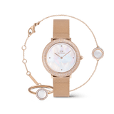 Rose gold ladies' watch set with mesh strap, sparkling crystal bezel, shimmering mother-of-pearl dial, matching bracelet and ring with mother-of-pearl inlay.