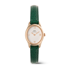 Orologio femminile Ophelia Mini con cassa ovale in oro rosa, quadrante bianco guilloché impreziosito da numeri romani e cinturino in pelle verde con texture effetto coccodrillo su sfondo bianco.