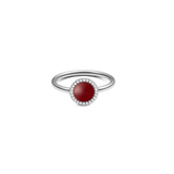 Silver ladies' ring with a round red agate as the centre stone, surrounded by a delicate row of white zirconia crystals on a simple, polished band.
