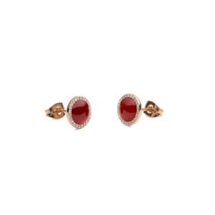 Two Audrey stud earrings in rose gold with round red agate and a delicate zirconia halo, elegantly and intricately designed.