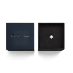 The Audrey Bracelet Mother of Pearl Silver is presented in an elegant black gift box with the Daniel Wellington logo.
