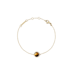 Bracciale Audrey con ciondolo bombato in occhio di tigre naturale, impreziosito da una cornice di zirconi bianchi. Realizzato in acciaio inossidabile con placcatura oro, è dotato di chiusura a moschettone regolabile.
